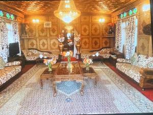 a living room with couches and a coffee table at Heevan in Srinagar