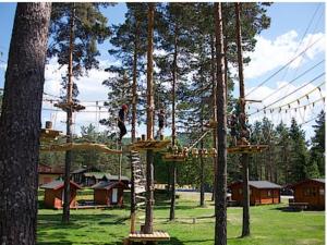a group of people riding on a swing at Loftsleilighet in Vennesla
