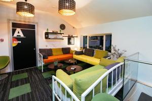 a living room with a couch and a table at Hostel 365 For U in Dubrovnik