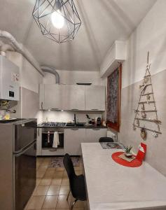 a kitchen with a table and a christmas tree at Le2sorelle in Ancona