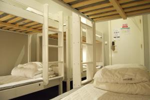 a room with two bunk beds in a room at Grad Hotel and Hostel in Stockholm +146 photos