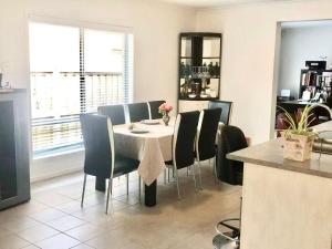a dining room with a table and chairs at Point Cook Homestay House in Point Cook