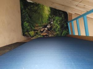 a room with a painting of a forest at Moss Haven on Hood Canal in Quilcene +11 photos