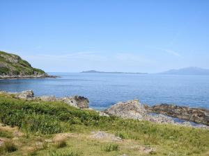a view of a body of water with rocks at Fascadale in Faskadale