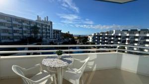 a balcony with a table and chairs on a balcony at Green Park ApartHotel Tenerife in San Miguel de Abona