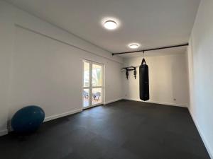 an empty room with a punching bag on the wall at Holiday Home Marković in Bibinje