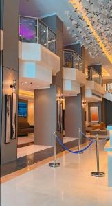 a lobby with a staircase in a building at فندق بارك برايم - Park Prime Hotel in Mecca