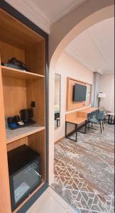 a room with a fireplace and a living room at فندق بارك برايم - Park Prime Hotel in Mecca +27 photos