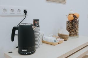 a coffeemaker sitting on a kitchen counter with food at TeXeda Room Suites in Tejeda +25 photos