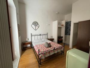 a bedroom with a bed in a room at Guiscardo Suites in Bari