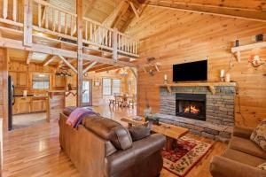a living room with a couch and a fireplace at Starry Mountain Night- Private Pool, Pool Table in Stanton