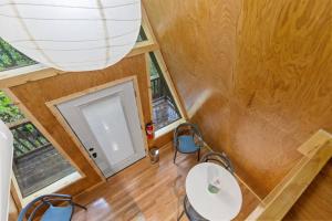 an overhead view of a tiny house with a table and chairs at A-Frames Under the Canopy - Multi-Cabin Retreat in Pine Ridge +52 photos