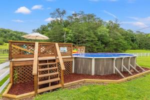 a pool with a wooden fence around it at Hidden Treasure- Private Pool, Pond, 1600 Acres in Clay City