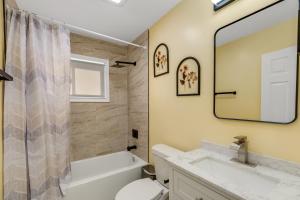 a bathroom with a sink toilet and a mirror at Furnished Private Room in a Spacious Shared Home#3 in Norton