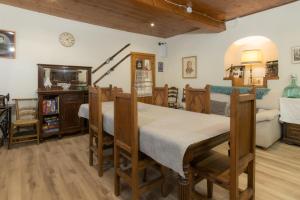 a room with a bed and a couch and a table at Casa Jansú in Escuñau