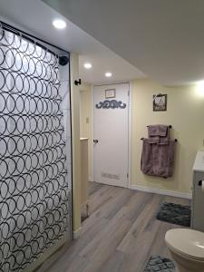 a bathroom with a toilet and a door at Carrousel Bed & Breakfast in Cayuga +21 photos