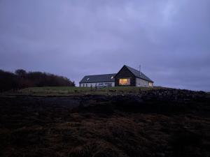 a house sitting on top of a hill at Dunvegan Steading Bed and Breakfast in Dunvegan