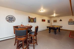 a room with a ping pong table and a pool table at R & R Cabin by Railey Vacations in McHenry +35 photos