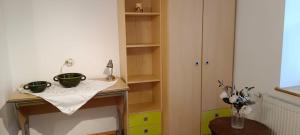 a kitchen with a table with two bowls on it at Ferienwohnung Weißenstein in Weissenstein +5 photos