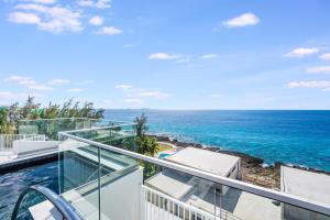 an ocean view from the balcony of a house at Point West Premier Rentals in West Bay