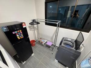 a room with a treadmill next to a machine at Shinchan homestay in Skudai