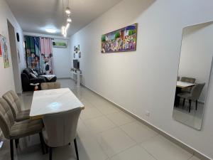 a waiting room with a table and chairs in a room at Shinchan homestay in Skudai