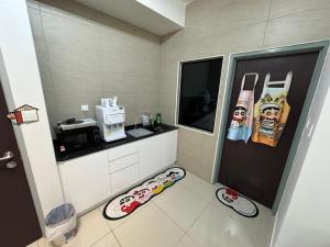 a small kitchen with a counter and a counter top at Shinchan homestay in Skudai +26 photos