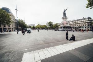 a city square with a statue in the middle at Korner République in Paris +11 photos