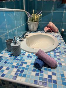 a bathroom with a tub and a purple towel on a counter at Studio flat in Sardinia Costa Smeralda in Porto Rotondo +19 photos