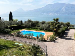 a swimming pool with a view of the ocean at Casa Pagani in Brenzone sul Garda