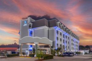a rendering of a hotel with a sunset at Best Western Kenner in Kenner