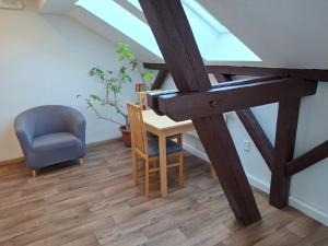 a room with a desk and a chair and a window at Ubytovna U Kašny in Uherské Hradiště