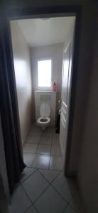 a small bathroom with a toilet and a window at Les Eucalyptus in Vesseaux +11 photos