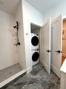 a laundry room with a washer and dryer at Downtown Providence FREE parking in Providence +16 photos