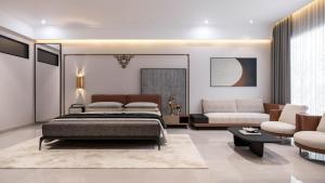 a bedroom with a bed and a couch at Hotel Presidency in Surat +26 photos