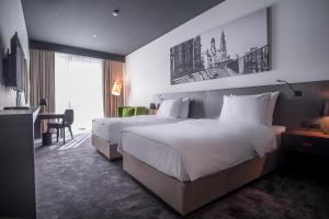 Voodi või voodid majutusasutuse Crowne Plaza Podgorica by IHG toas