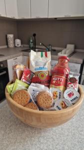 a basket of food on a counter in a kitchen at Bandìtella home in Livorno +12 photos
