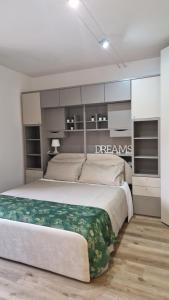 a bedroom with a large bed in a room at Bandìtella home in Livorno