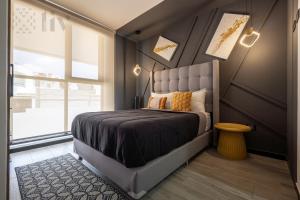 a bedroom with a large bed and a window at Apartment home resort in La Cañada +113 photos