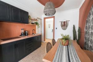 a kitchen with a table and a dining room at Lofts Álvaro Obregón in Mexico City +25 photos