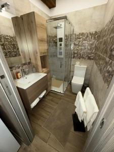 a bathroom with a shower and a sink and a toilet at Casa Vacanze Jennifer in Catania