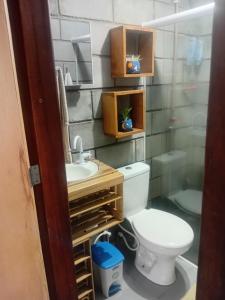 a bathroom with a toilet and a sink at Villa Madalena Lofts in Maceió +15 photos