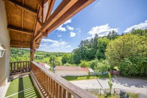 a view from the balcony of a house at Gîte familial à Jezainville - Nature, terrasses & jardin clos, Vue vallée, forêt in Jezainville