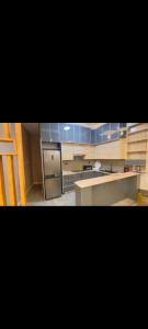 a kitchen with a sink and a stove top oven at Guest house in Addis Ababa