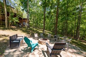 a group of chairs sitting around a fire pit at Cozy Cabin by Railey Vacations in Oakland +36 photos