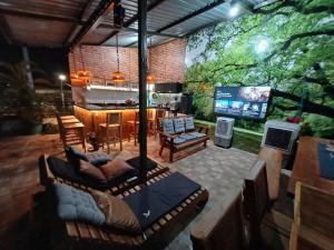 an outdoor patio with a bar and a bar at Loft dos sonhos cobertura in Boa Vista