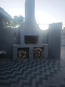 a living room with a fire place in a building at Ludiz Self Catering Accommodation in Avondale