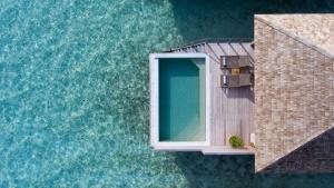 an overhead view of a building and the water at Hurawalhi Island Resort in Kuredu