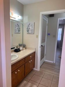 a bathroom with a sink and a mirror at Wine’D Up in Fredericksburg +26 photos
