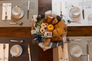 a basket of bread and pastries on a table at Palazzo Marini in Spoleto